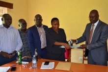 CAOS Michael Wanje and Stella Abyeto during handover ceremony at Planning Unkit Board Room